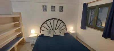 Letto o letti in una camera di Villa Tonino