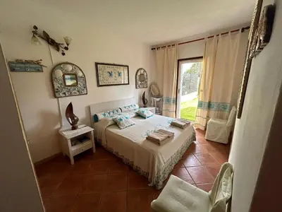 Letto o letti in una camera di Baia Verde - Seaside Peaceful Luxury Villa with Garden in Sardinia - 300 mt beach&sea - relax, privacy & full comfort