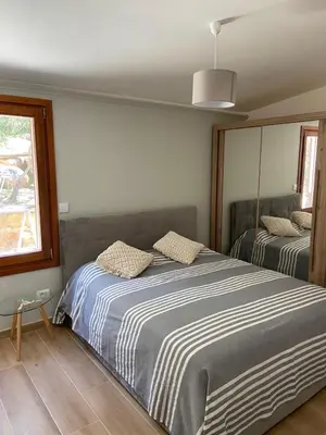 Letto o letti in una camera di Villa Valeria