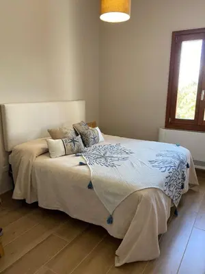 Letto o letti in una camera di Villa Valeria