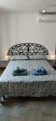 Letto o letti in una camera di Casa Carla Maria - Da e Nònne