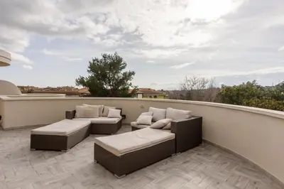 Area soggiorno di GuestHost - Comfortable Terrace Apartment - Sestu