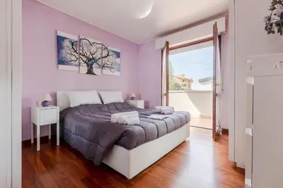 Letto o letti in una camera di GuestHost - Comfortable Terrace Apartment - Sestu
