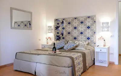 Letto o letti in una camera di Just Rooms