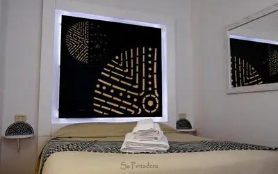 Letto o letti in una camera di Just Rooms