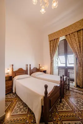 Letto o letti in una camera di Hotel AeR BJ Vittoria