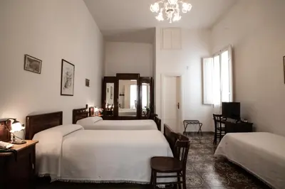 Letto o letti in una camera di Hotel AeR BJ Vittoria