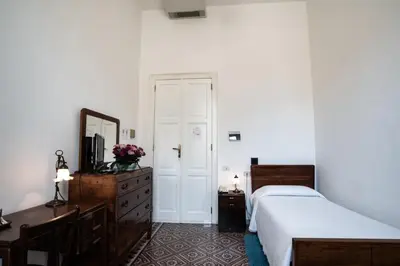 Letto o letti in una camera di Hotel AeR BJ Vittoria
