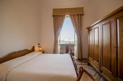 Letto o letti in una camera di Hotel AeR BJ Vittoria