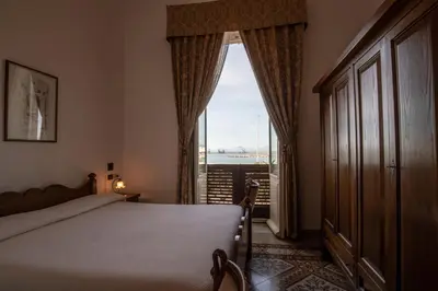 Letto o letti in una camera di Hotel AeR BJ Vittoria
