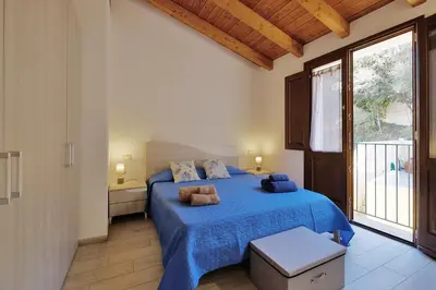 Letto o letti in una camera di Dimora blù al centro by Teuladaapartments