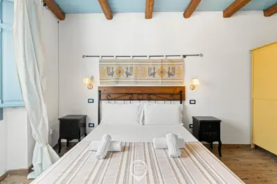 Letto o letti in una camera di Albachiara