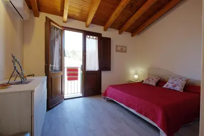 Letto o letti in una camera di Dimora Rossa - casa baronale by Teuladaapartments