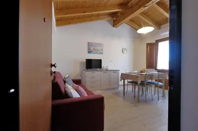 TV o dispositivi per l'intrattenimento presso Dimora Rossa - casa baronale by Teuladaapartments