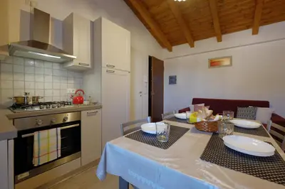 Cucina o angolo cottura di Dimora Rossa - casa baronale by Teuladaapartments