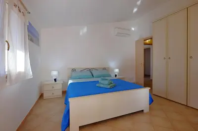 Letto o letti in una camera di Il giardino di Marina by Teuladaapartments