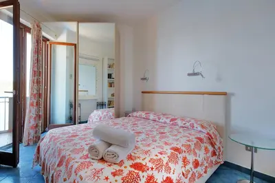 Letto o letti in una camera di Rosy terrazza sul mare by Teuladaapartments