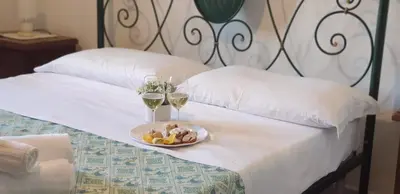 Letto o letti in una camera di Cantina Marongiu
