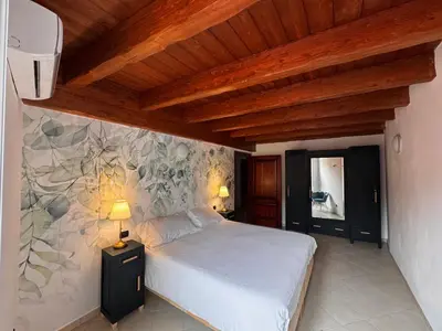 Letto o letti in una camera di Macrù Apartments