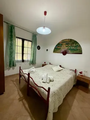 Letto o letti in una camera di Casa Mimosa