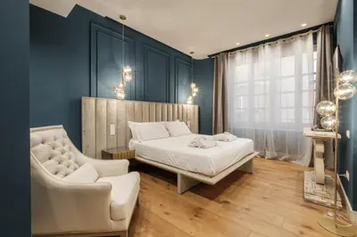 Letto o letti in una camera di Luxury Suites in the Heart of Cagliari