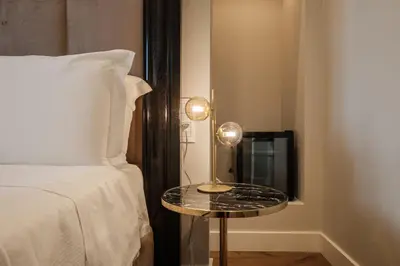 Letto o letti in una camera di Luxury Suites in the Heart of Cagliari