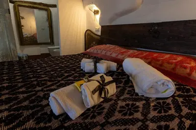 Letto o letti in una camera di Le Cementine
