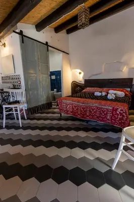 Letto o letti in una camera di Le Cementine
