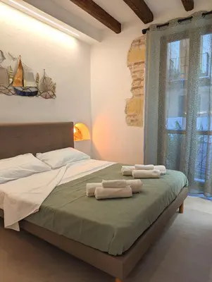 Letto o letti in una camera di Casa di Leda 3
