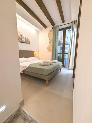 Letto o letti in una camera di Casa di Leda 3