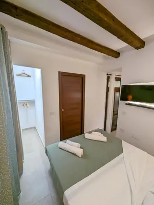 Letto o letti in una camera di Casa di Leda 3