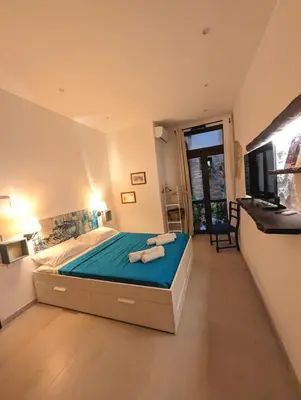 Letto o letti in una camera di Casa di Leda 2