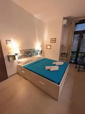 Letto o letti in una camera di Casa di Leda 2