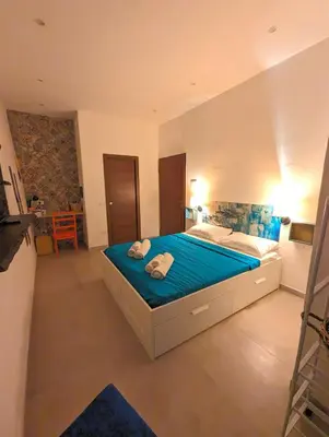 Letto o letti in una camera di Casa di Leda 2