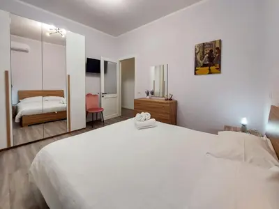 Letto o letti in una camera di Guest House - Vivamus Large and Elegant apartment