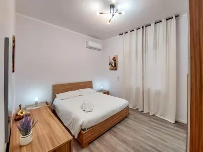 Letto o letti in una camera di Guest House - Vivamus Large and Elegant apartment