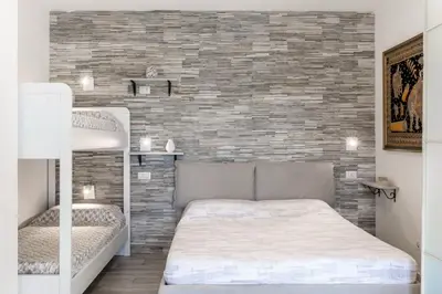 Letto o letti in una camera di Domu de Mari- Free Beach Residence