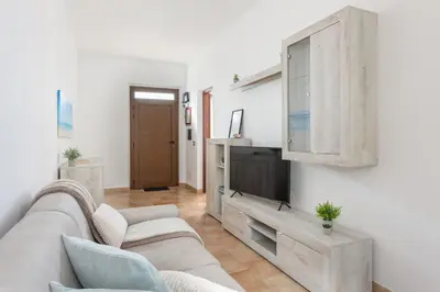 TV o dispositivi per l'intrattenimento presso Costa Ovest Apartment 2