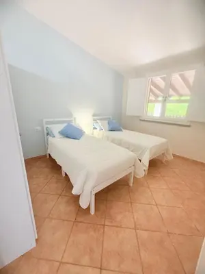 Letto o letti in una camera di Casa Boeri - Vista mare con piscina e giardino Residence Abba Urci