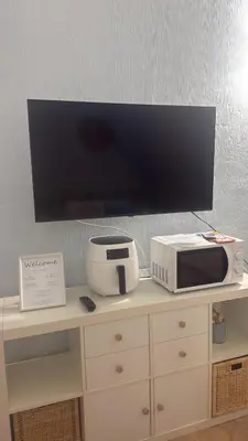 TV o dispositivi per l'intrattenimento presso Casa Boeri - Vista mare con piscina e giardino Residence Abba Urci