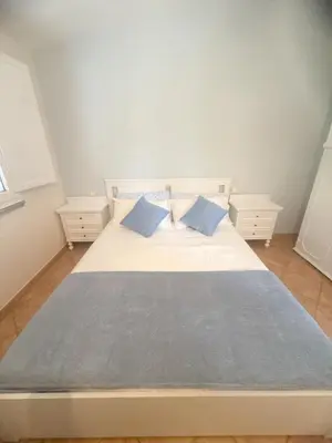 Letto o letti in una camera di Casa Boeri - Vista mare con piscina e giardino Residence Abba Urci