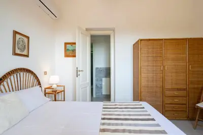 Letto o letti in una camera di Villa Sara, a pochi passi dalla spiaggia, Sud Sardegna