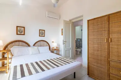 Letto o letti in una camera di Villa Sara, a pochi passi dalla spiaggia, Sud Sardegna