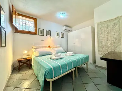 Letto o letti in una camera di Colori di Sardegna Apartments