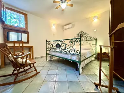 Letto o letti in una camera di Colori di Sardegna Apartments