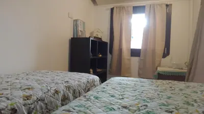 Letto o letti in una camera di Alma House