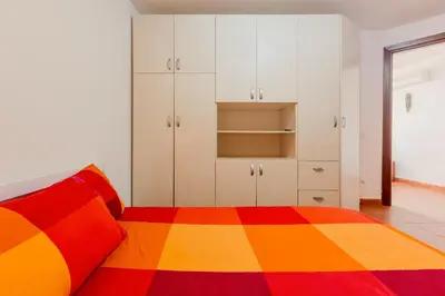 Letto o letti in una camera di GuestHost - Casa Asia a Chia