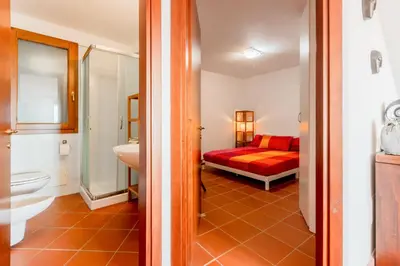 Letto o letti in una camera di GuestHost - Casa Asia a Chia