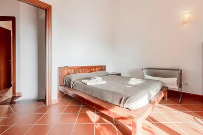 Letto o letti in una camera di GuestHost - Casa Asia a Chia