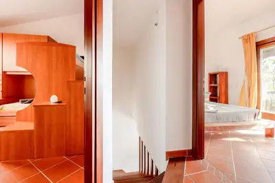 Letto o letti in una camera di GuestHost - Casa Asia a Chia